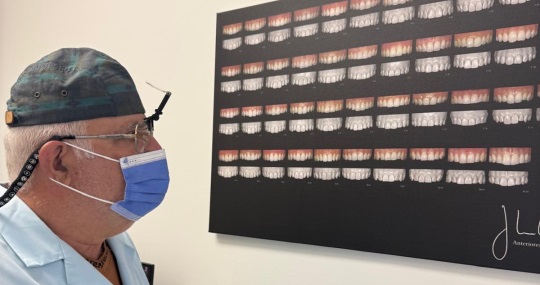 Dentist reviewing tooth-shade examples